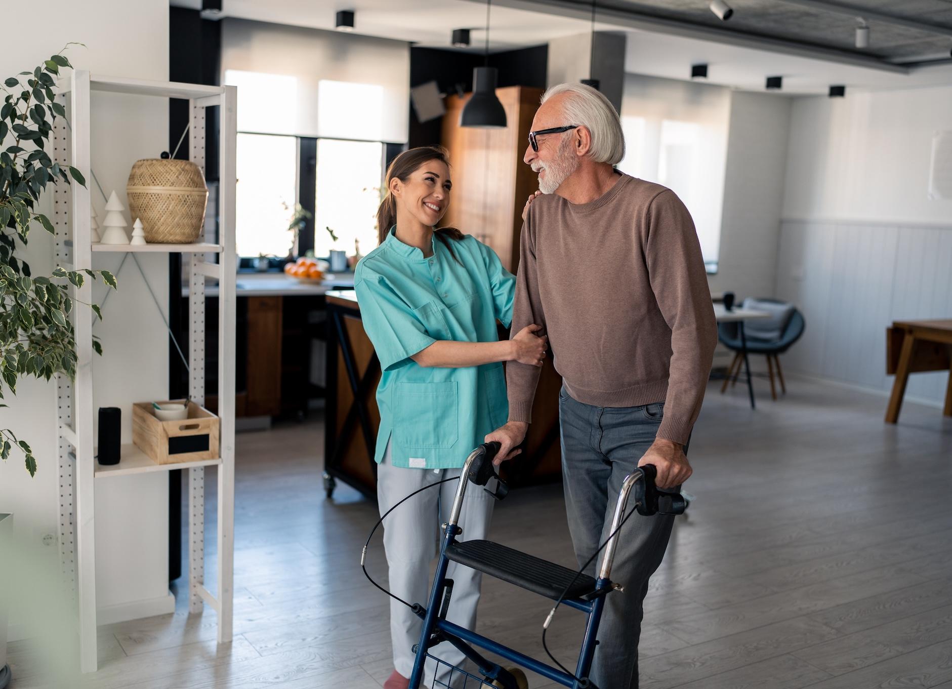Blog 2 Nurse walks with senior man at home