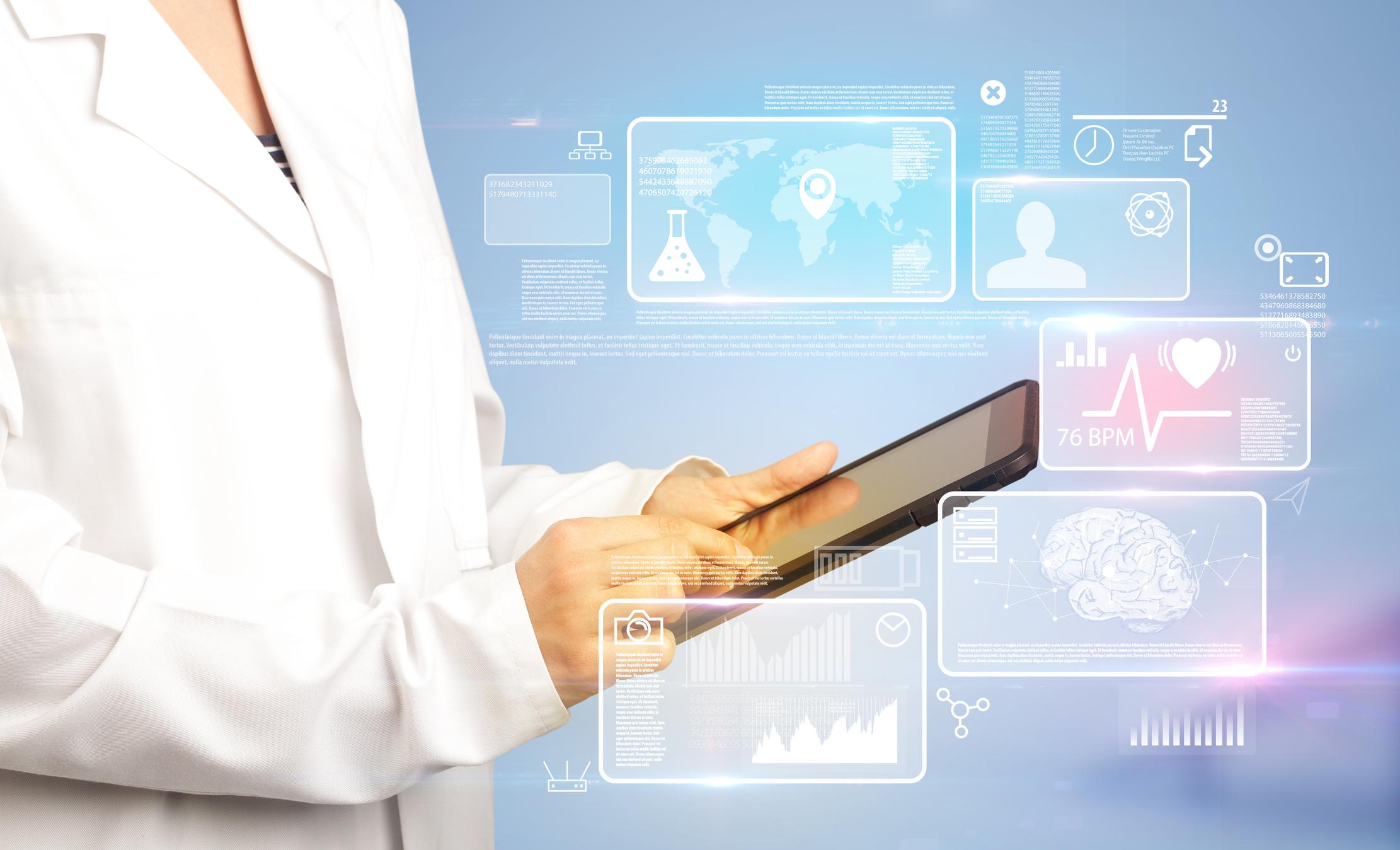 Blog 1 Female doctor with tablet and health data